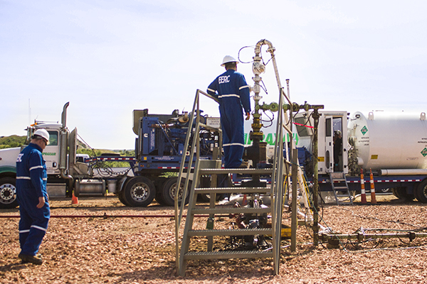 EERC employees at an oil rig